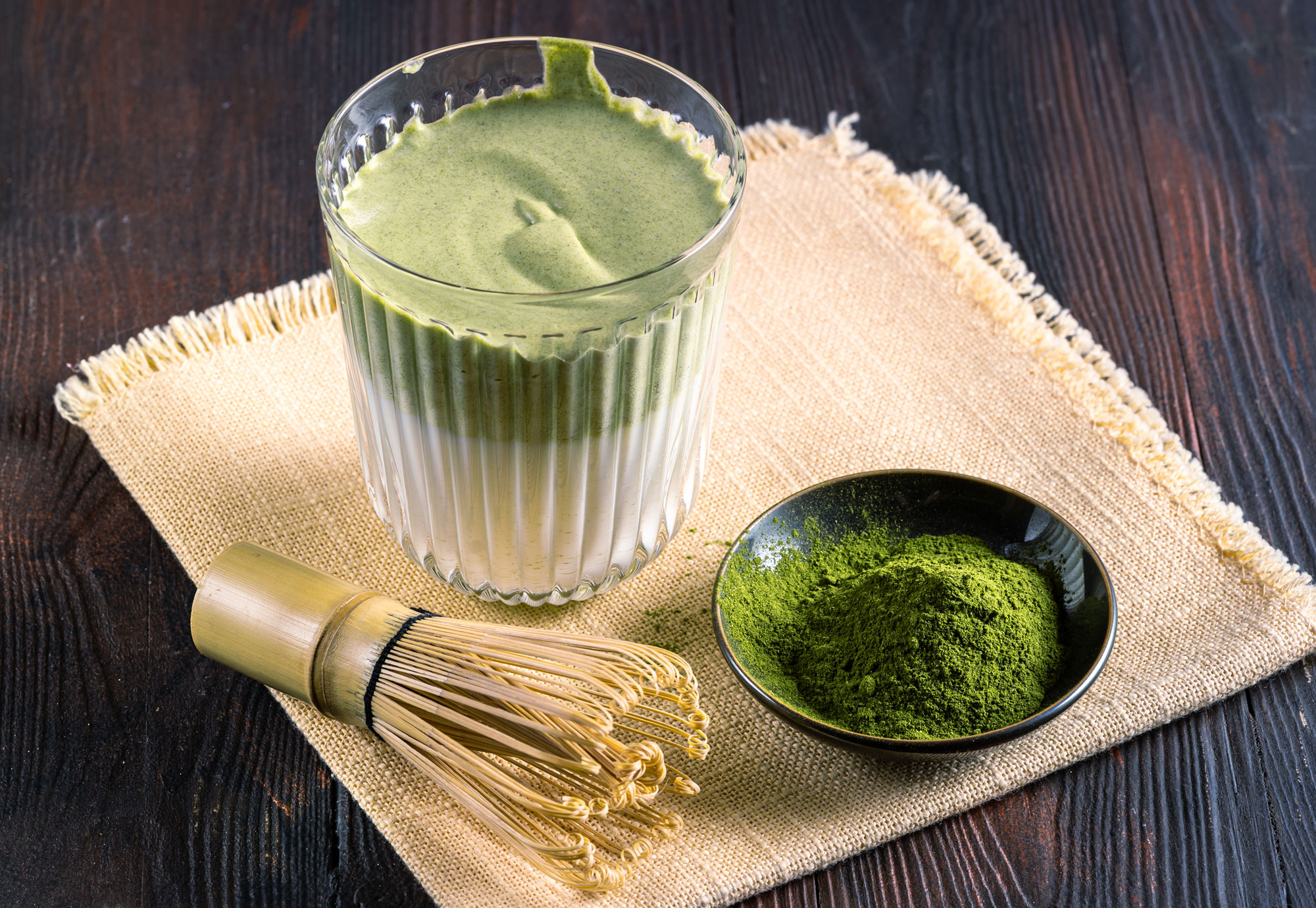 Matcha powder for latte mixed with milk for a smooth commercial beverage